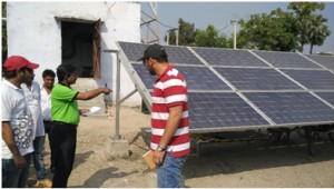 Yatris being shown the solar plant at work